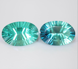 Пара голубовато-зеленых флюоритов лазерной огранки 30,25 карата
